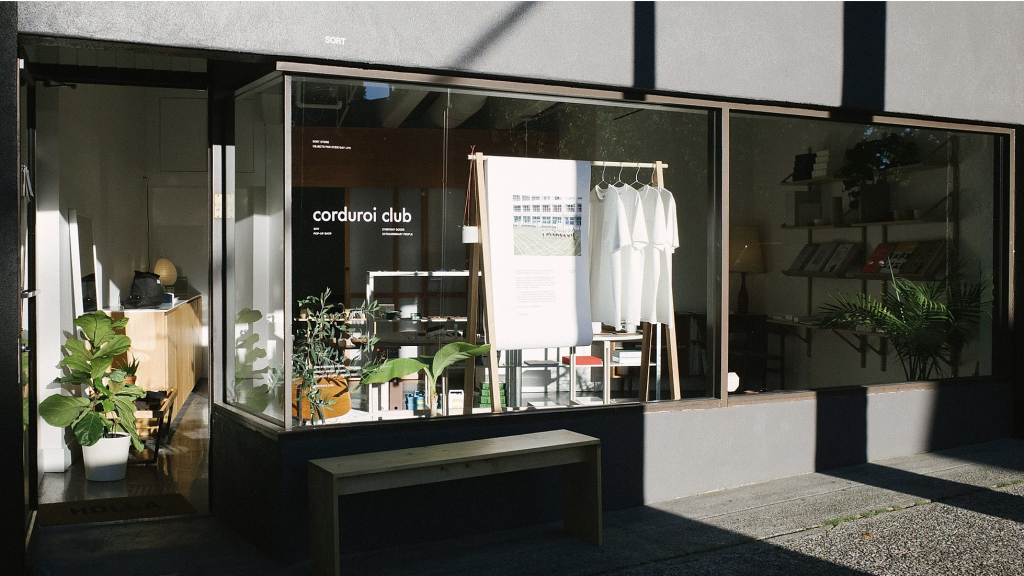 Corduori clubs' first pop up shop at SORT in Kitsilano, Vancouver. Photo fo window display with shirts, plants and other accessories 